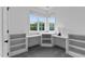 Bright office space with built-in shelves and corner windows at 310 Hidden Lake Dr, Youngsville, NC 27596