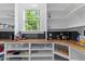 Spacious pantry with wooden countertops, black tiled backsplash, ample shelving, and a window at 310 Hidden Lake Dr, Youngsville, NC 27596