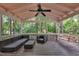 Outdoor back porch featuring ceiling fan and patio furniture at 3205 Dell Dr, Raleigh, NC 27609