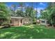 Large private backyard with separate outbuilding at 3205 Dell Dr, Raleigh, NC 27609