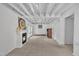 Finished basement with fireplace and exposed ceiling beams at 3205 Dell Dr, Raleigh, NC 27609