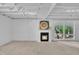 Basement featuring a fireplace and large windows at 3205 Dell Dr, Raleigh, NC 27609