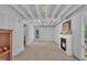 Spacious basement area with exposed ceiling beams and lighting at 3205 Dell Dr, Raleigh, NC 27609
