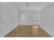 Bright bedroom with neutral walls and hardwood floors at 3205 Dell Dr, Raleigh, NC 27609