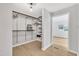 Walk-in closet with custom shelving, conveniently placed off bedroom at 3205 Dell Dr, Raleigh, NC 27609