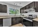 Updated kitchen with granite counters, modern appliances and stylish pendant lighting at 3205 Dell Dr, Raleigh, NC 27609