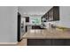Spacious kitchen with granite countertops, stainless appliances, and ample cabinet space at 3205 Dell Dr, Raleigh, NC 27609