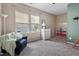 A tranquil bedroom with a comfortable chair, dresser, and bright natural light at 3312 Flat River Dr, Durham, NC 27703