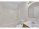 Bright bathroom featuring a shower-tub combo, single vanity, and an oval mirror at 35 Stratton Ct, Youngsville, NC 27596