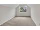Bedroom with neutral walls and carpet floors, featuring natural light at 35 Stratton Ct, Youngsville, NC 27596