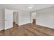 Bedroom with wood-look floors, ceiling fan, and view into attached bathroom at 35 Stratton Ct, Youngsville, NC 27596