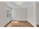 Neutral bedroom with gleaming hardwood floors and decorative light fixture at 35 Stratton Ct, Youngsville, NC 27596