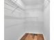 Closet featuring lots of wired shelving, wood-look floors, and neutral walls at 35 Stratton Ct, Youngsville, NC 27596