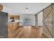 Open dining room with sliding barn door and access to outdoor deck at 35 Stratton Ct, Youngsville, NC 27596