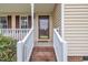 Charming front entrance with brick steps and classic railings, creating a welcoming first impression for guests at 35 Stratton Ct, Youngsville, NC 27596