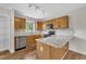 Well-lit kitchen with wooden cabinets and a track lighting system at 35 Stratton Ct, Youngsville, NC 27596