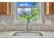 Beautiful view from the window above the stainless steel kitchen sink at 35 Stratton Ct, Youngsville, NC 27596