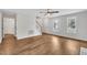 Bright and airy living room with hardwood floors, showcasing a staircase and views to the outside, perfect for relaxation at 35 Stratton Ct, Youngsville, NC 27596
