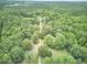 Secluded estate with long driveway surrounded by mature trees offering privacy and tranquility at 3679 Oak Lawn Farm Rd, Oxford, NC 27565