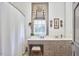Bright bathroom with a vanity area, patterned window treatment, and a shower with white waffle curtain at 3679 Oak Lawn Farm Rd, Oxford, NC 27565