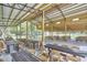 Large outdoor event space featuring high ceilings and tables with chairs for guests at 3679 Oak Lawn Farm Rd, Oxford, NC 27565