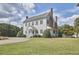 Charming colonial style home with manicured lawn and a brick chimney at 3679 Oak Lawn Farm Rd, Oxford, NC 27565