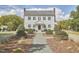 Colonial style home with covered entryway and lush landscaping at 3679 Oak Lawn Farm Rd, Oxford, NC 27565