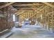 Open wood-framed interior space with a piano and hardwood flooring at 3679 Oak Lawn Farm Rd, Oxford, NC 27565