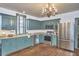 Well-equipped kitchen features stainless steel appliances, abundant counter space, and wood floors at 3679 Oak Lawn Farm Rd, Oxford, NC 27565