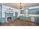 Spacious kitchen with ample counter space, original hardwood floors, and a fireplace at 3679 Oak Lawn Farm Rd, Oxford, NC 27565