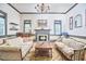 Spacious living room with elegant decor, fireplace, and plenty of seating at 3679 Oak Lawn Farm Rd, Oxford, NC 27565
