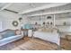 Bright sitting room with a daybed, couch, and shelves at 3679 Oak Lawn Farm Rd, Oxford, NC 27565