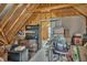 Unfinished attic with exposed beams, storage shelves, and boxes at 3728 Marwick Ct, Wendell, NC 27591