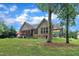 Exterior view features a home with a screened-in porch and covered carport at 3728 Marwick Ct, Wendell, NC 27591