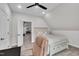 Cozy bedroom features neutral tones, a ceiling fan, carpet flooring, and an ensuite with a pool table at 3728 Marwick Ct, Wendell, NC 27591