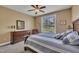 Bedroom boasts a large window with views, traditional furnishings, and ceiling fan at 3728 Marwick Ct, Wendell, NC 27591