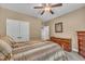 Comfortable bedroom features neutral decor, ceiling fan, and traditional furniture at 3728 Marwick Ct, Wendell, NC 27591