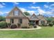 Charming brick home featuring a beautifully landscaped front yard and a mix of brick and shingle exterior at 3728 Marwick Ct, Wendell, NC 27591