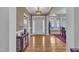 Elegant foyer featuring hardwood floors, decorative lighting, and a view into the adjacent dining area at 3728 Marwick Ct, Wendell, NC 27591