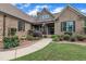 Close-up of home's entrance with inviting porch, detailed brickwork, and manicured landscaping along the walkway at 3728 Marwick Ct, Wendell, NC 27591