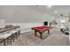 Spacious game room with a billiards table, bar, and carpet flooring at 3728 Marwick Ct, Wendell, NC 27591