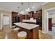 Modern kitchen island with granite counters, pendant lights, and seating overlooking the dining area at 3728 Marwick Ct, Wendell, NC 27591