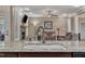 Close up of a granite counter top and sink in the kitchen overlooking a living room at 3728 Marwick Ct, Wendell, NC 27591