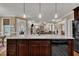 Kitchen island with granite countertop and sink overlooking living area at 3728 Marwick Ct, Wendell, NC 27591