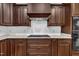 Modern kitchen featuring stainless appliances, dark wood cabinetry, and white subway tile backsplash at 3728 Marwick Ct, Wendell, NC 27591
