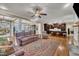 Open-concept living room and kitchen with hardwood floors and ample seating at 3728 Marwick Ct, Wendell, NC 27591