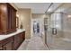 Main bathroom with a double sink, shower, bathtub, and walk in closet at 3728 Marwick Ct, Wendell, NC 27591