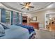 Spacious main bedroom features a fan, large windows, and wood furniture at 3728 Marwick Ct, Wendell, NC 27591