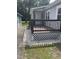 Cozy back deck with brown railings and latticework, bordered by decorative white stones at 40 Bait Rd, Dunn, NC 28334