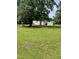 Exterior view of a house with light-colored siding and green grass at 40 Bait Rd, Dunn, NC 28334